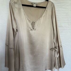 100% silk blouse, bell sleeves with a split and a tie.  Beautiful cream color.